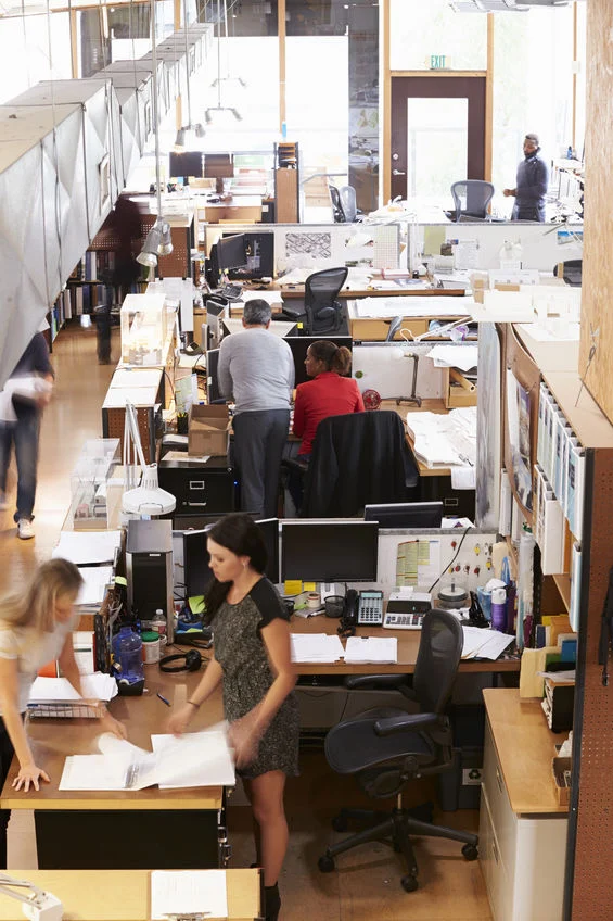Interior Of Busy CGO Media Office in London With Staff Working