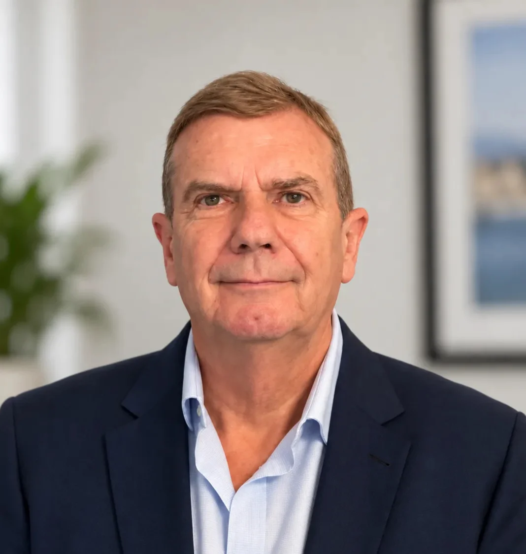 CGO_Media_Founder_Professional_Portrait Professional head-and-shoulders portrait of the CGO Media founder Roger Wilkinson wearing a navy blazer and light blue shirt.